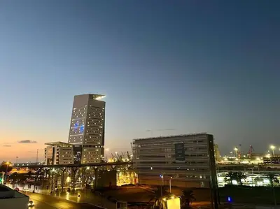 a city skyline with tall buildings at night at Studio Haven in the Old Medina in Casablanca