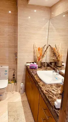 a bathroom with a sink and a toilet at Bel appartement pieds sur mer in Casablanca