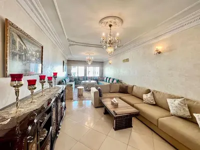 a living room with a couch and a table at CASA Ghandi Central Apart 1Ch salon in Casablanca