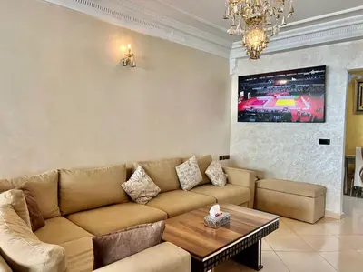 a living room with a couch and a table at CASA Ghandi Central Apart 1Ch salon in Casablanca