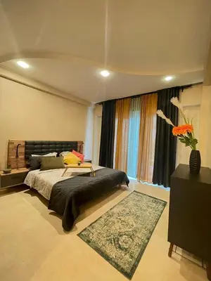 a bedroom with a large bed and a window at Un bijou d'élégance au coeur du quartier Racine de Casablanca in Casablanca