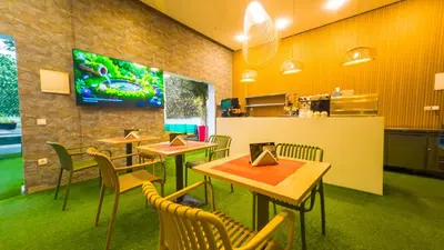 a restaurant with tables and chairs and a counter at Rent-inn Boutique Hotel in Rabat