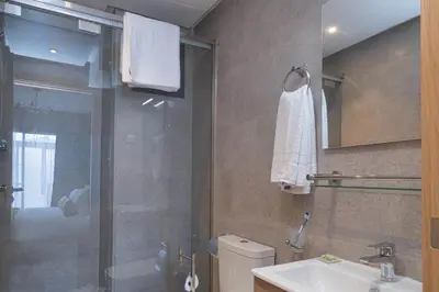 a bathroom with a shower and a toilet and a sink at Rent-inn Boutique Hotel in Rabat