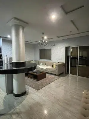 a living room with a couch and a table at Appartement meublé à louer Rabat in Rabat