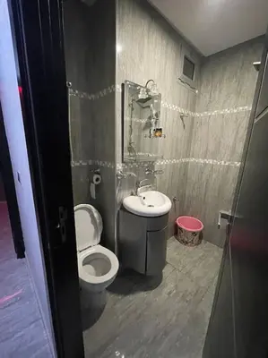 a bathroom with a toilet and a sink at Appartement meublé à louer Rabat in Rabat