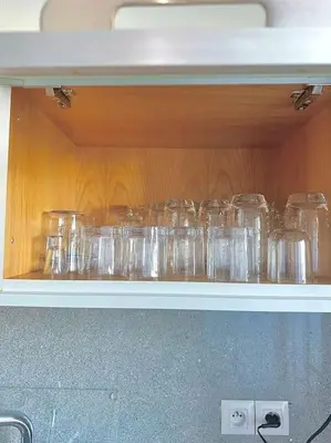 a shelf with many glass jars on it at Lilias Appart - 2 Mars in Casablanca
