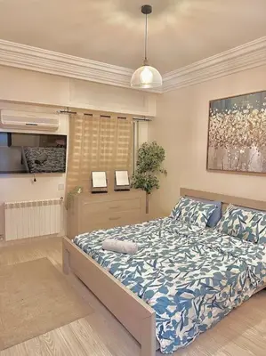a bedroom with a large bed in a room at Lilias Appart - 2 Mars in Casablanca