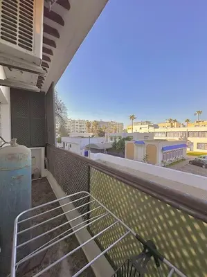 a balcony with a bed on top of a building at Lilias Appart - 2 Mars in Casablanca