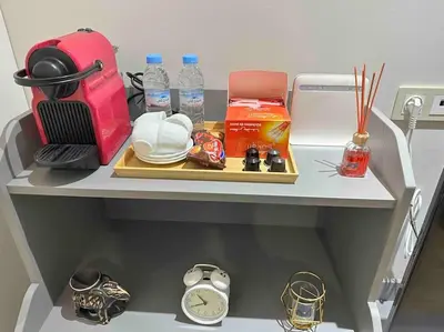 a shelf with a table with items on it at Racine Studio bd Anfa in Casablanca