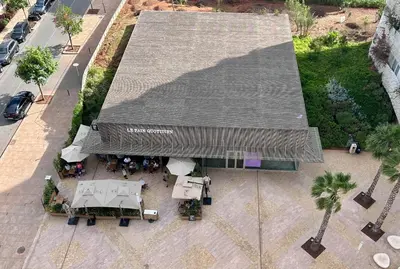 an overhead view of a restaurant with a roof at Anfa Finance City CFC! Magnifique Apt Tours Végétales, grande terrasse, piscine, parking in Casablanca
