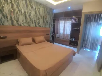 a bedroom with a large bed in a room at Appartement joelle in Casablanca