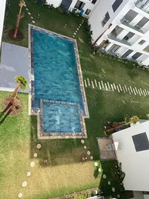 an overhead view of a swimming pool in a yard at Luxueux Appart à 5 min aéroport mohamed 5 in Nouaceur