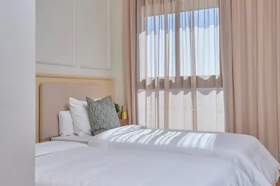 a bedroom with two beds and a window at YourPlace Rabat - Royal Residence in Rabat