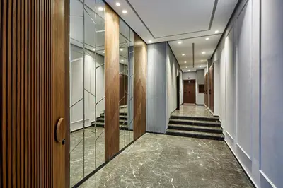 a hallway with a staircase with glass walls and a stairwayngth at Charming 1 Bed Casablanca Retreat With Free Parking in Casablanca