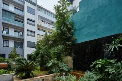 a building with a tree in front of it at Charming 1 Bed Casablanca Retreat With Free Parking in Casablanca