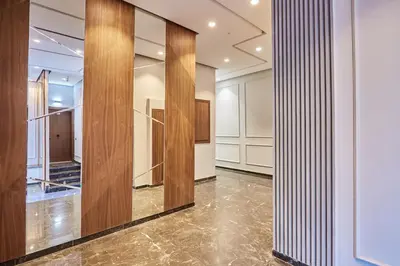 a dressing room with wood panels and mirrors at Sleek and Modern 2-Bed Unit in Downtown Casa in Casablanca