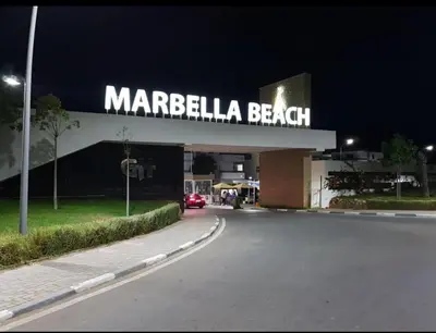 a margela beach sign on the side of a building at Marbella Beach Almansouria in Mansouria