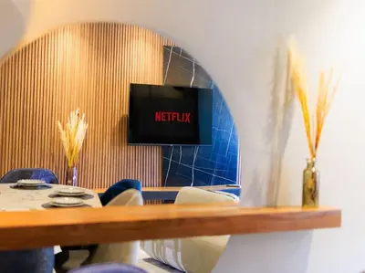 a waiting room with a tv on a wall at Chic & Spacious : 3BR Apartment in Central Rabat in Rabat