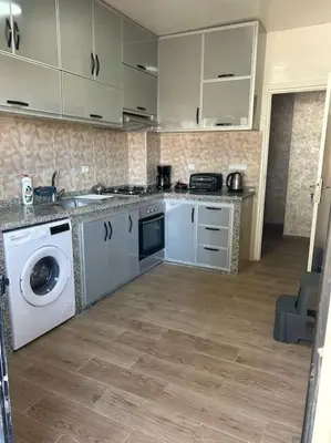 a kitchen with a washing machine and a dishwasher at appart casa voyageurs belvédère in Casablanca