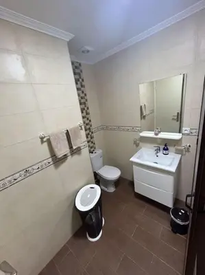 a bathroom with a toilet and a sink at appart casa voyageurs belvédère in Casablanca