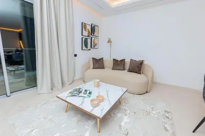 a living room with a couch and a coffee table at Aristocratic Abode: Luxurious 2BR Flat in Agdal in Rabat