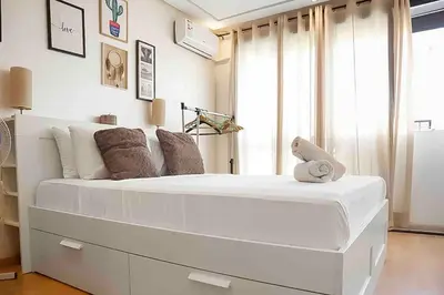 a large white bed in a room with a window at BeachSide marvel in Casablanca