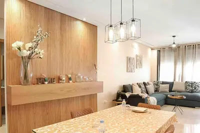 a living room with a table and a couch at BeachSide marvel in Casablanca