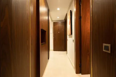 a hallway with wooden walls and a long hallway with at #3 New Upscale flat in new building in Casablanca