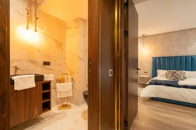 a bedroom with a bed and a bathroom with a sink at #3 New Upscale flat in new building in Casablanca