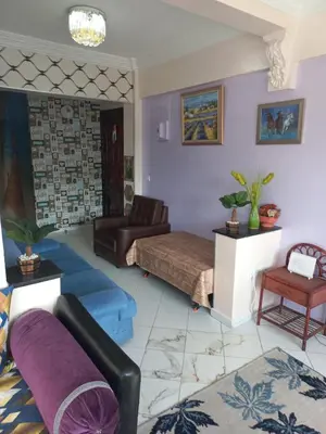 a living room with a bed and a couch at Appartement chic, moderne vue sur mer in Casablanca