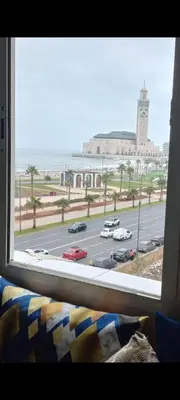 a window with a view of a parking lot at Appartement chic, moderne vue sur mer in Casablanca