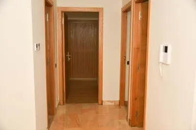 an empty hallway with two doors and a hallway at Luxurious Apt - Sea View in Pont Blondin