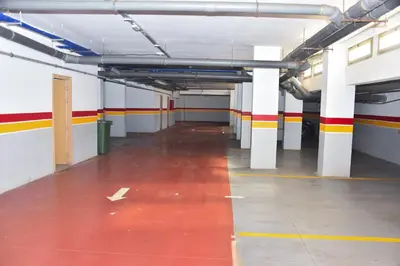 an empty parking garage with a red floor at Luxurious Apt - Sea View in Pont Blondin