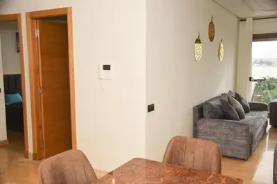 a living room with a couch and a table at Luxurious Apt - Sea View in Pont Blondin