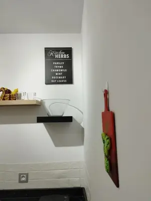 a white kitchen with a counter with a ingrediants at Mohammedia Relax in Mohammedia