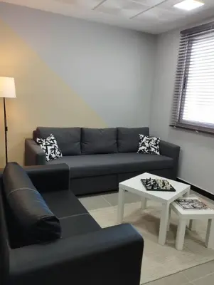 a living room with a couch and a table at Mohammedia Relax in Mohammedia
