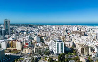 an aerial view of a city with the ocean in the background at Radisson Hotel Casablanca Gauthier La Citadelle in Casablanca