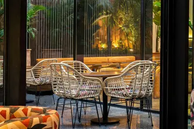 a group of chairs and a table in a restaurant at Radisson Hotel Casablanca Gauthier La Citadelle in Casablanca