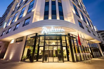 a building with a sign on the front of it at Radisson Hotel Casablanca Gauthier La Citadelle in Casablanca