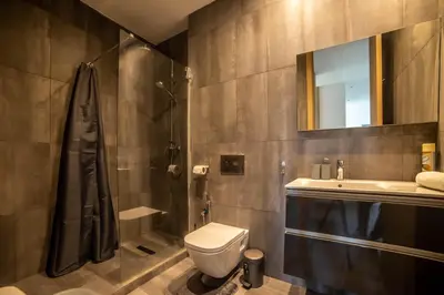 a bathroom with a toilet and a sink and a shower at Magnifique oasis de détente ! in Bouznika