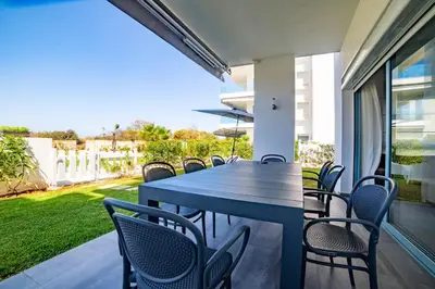 a blue table and chairs on a patio at Magnifique oasis de détente ! in Bouznika