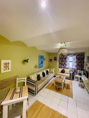 a living room with a couch and a table at Beautiful Studio In Casablanca in Casablanca