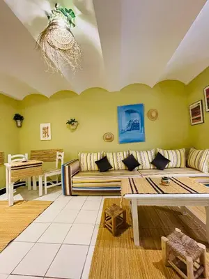 a living room with a couch and a table at Beautiful Studio In Casablanca in Casablanca
