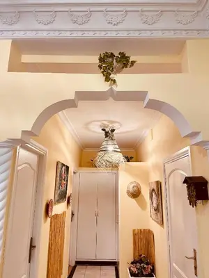 a hallway with a vase on the ceiling at Magnificent studio for two in the center of Casablanca in Casablanca