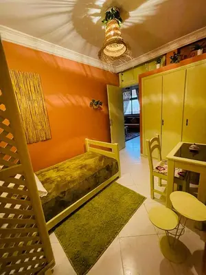 a bedroom with a bed and a table and chairs at Beautiful Studio in the heart of Casablanca in Casablanca