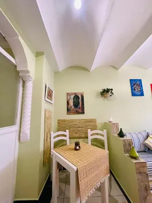 a dining room with a table and chairs at Charming Getaway in Casablanca Maroc, Cozy Home with Thoughtful Amenities in Casablanca