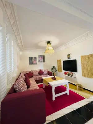a living room with a couch and a table at Coquet Appartement Casablanca in Casablanca