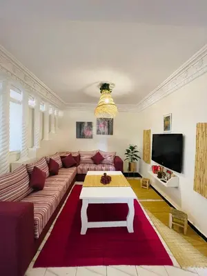 a living room with a couch and a coffee table at Coquet Appartement Casablanca in Casablanca