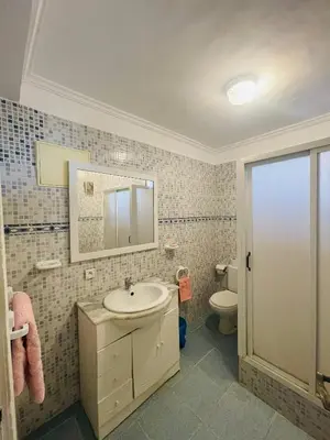 a bathroom with a sink and a toilet at Coquet Appartement Casablanca in Casablanca