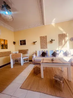 a living room with a couch and a table at Charming Studio In Casablanca in Casablanca